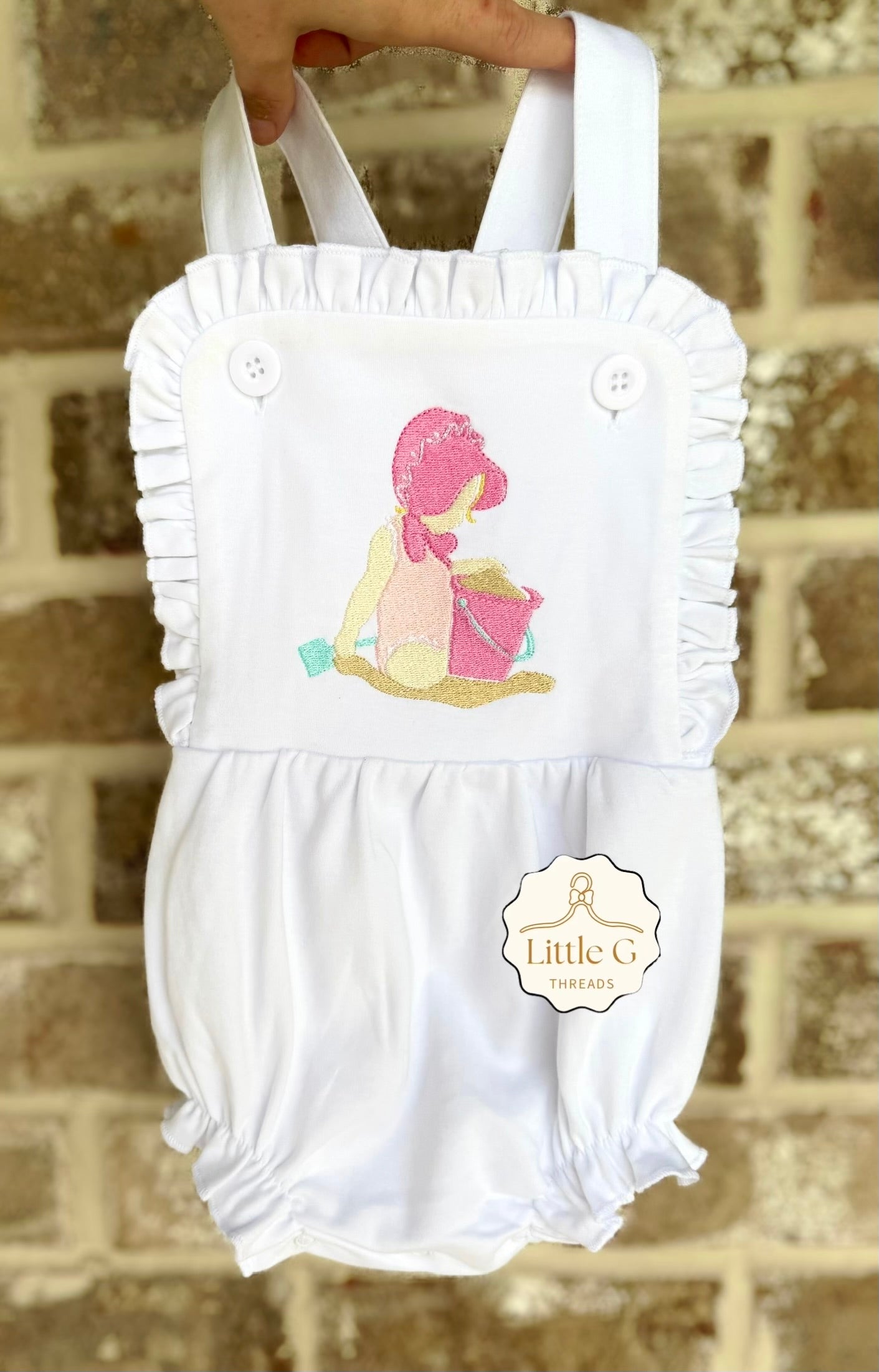 Baby in a bonnet Sunsuit